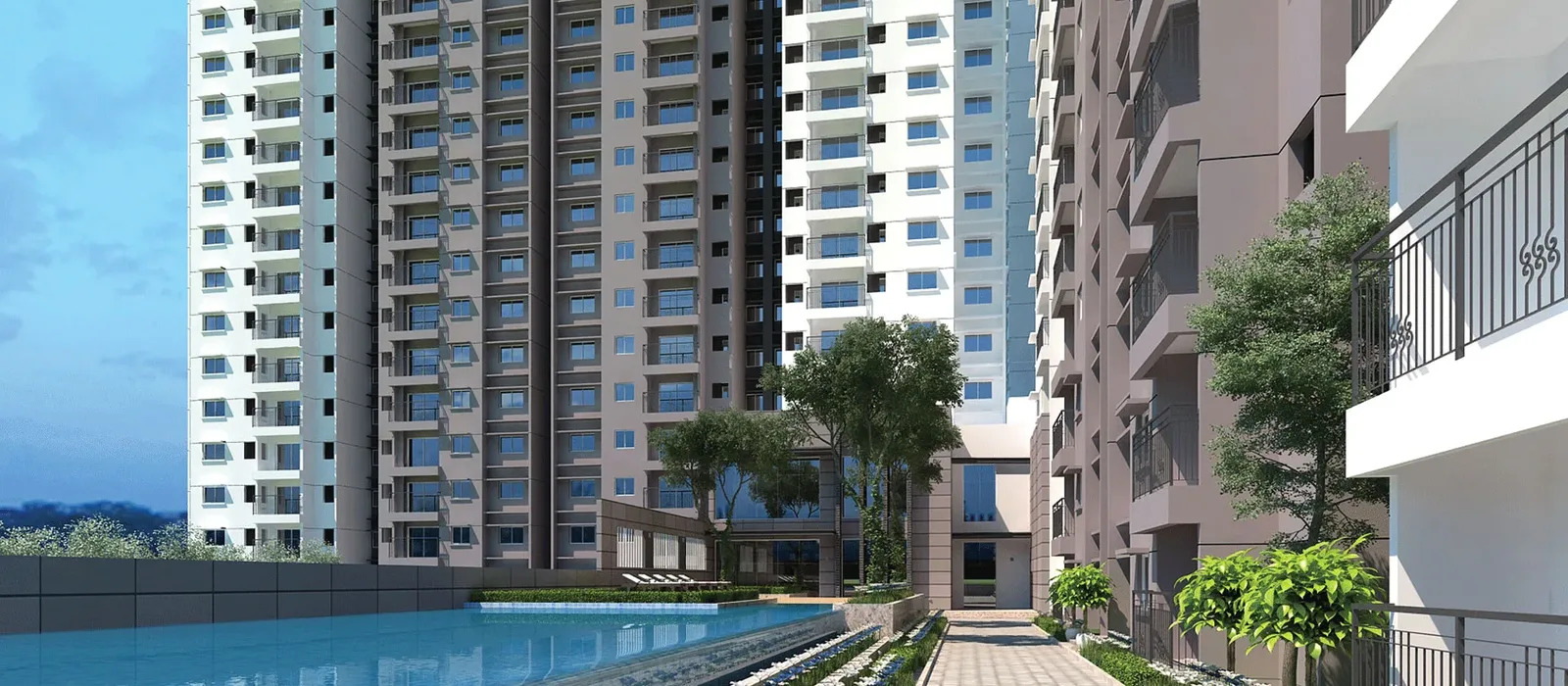 Prestige Kollur swimming pool and towers at dusk